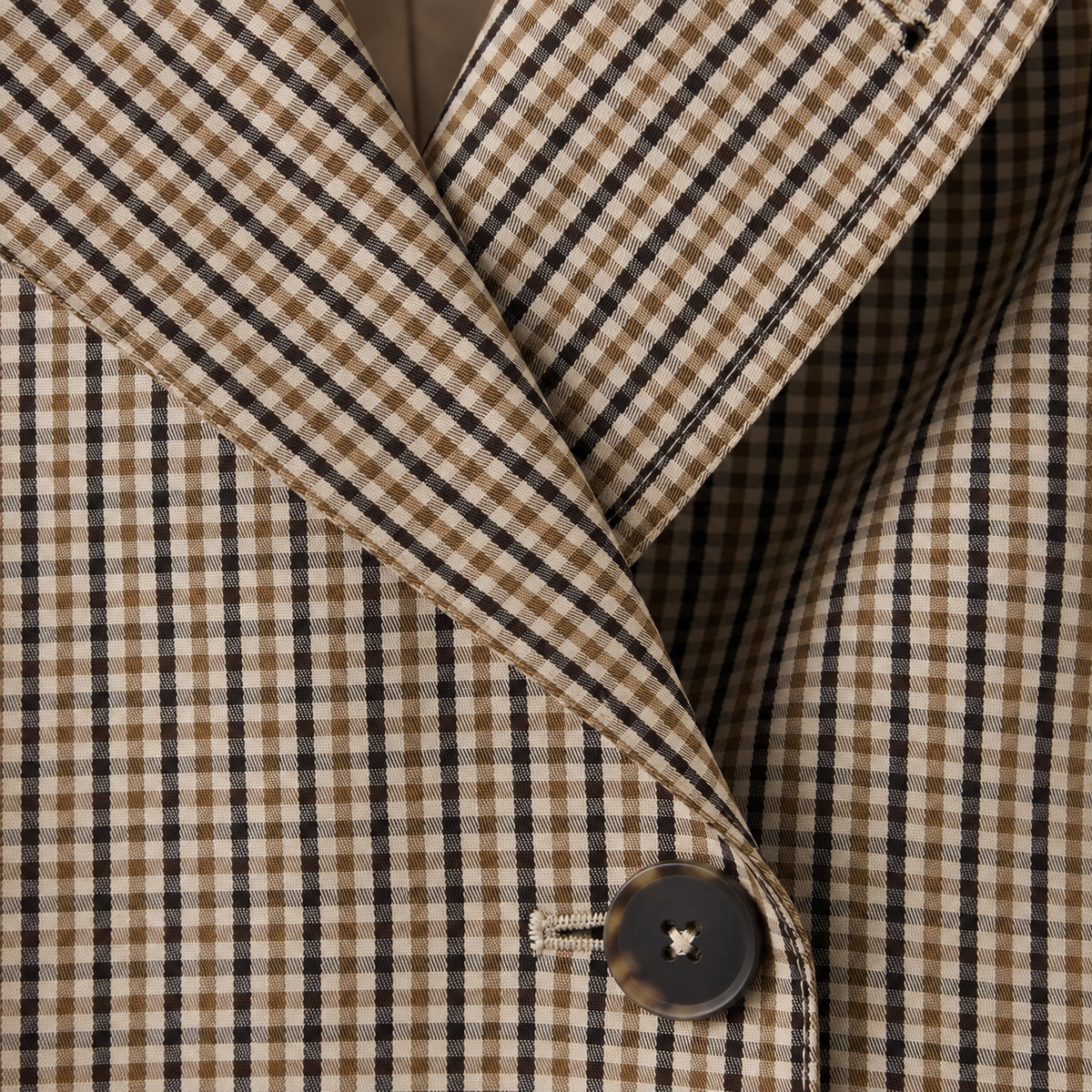 Short checked trench coat with belt